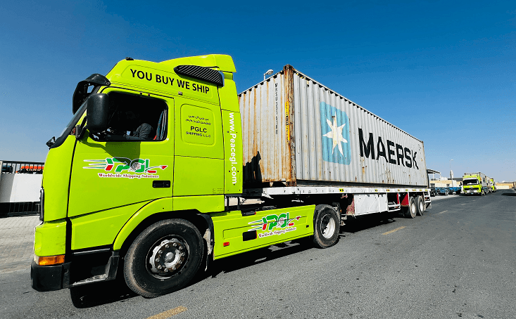A PGL truck hauling a shipping container
